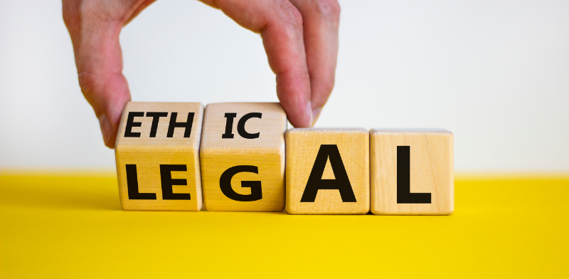 photo of the words ethical and legal on wooden blocks