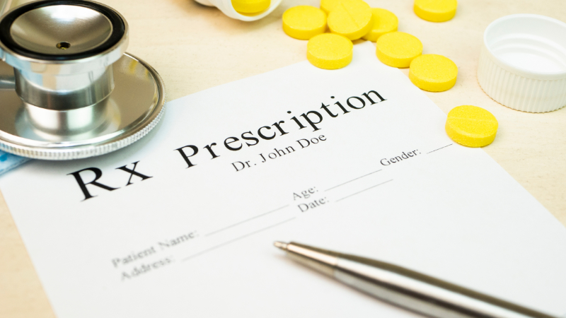 photo of prescription paper and medication