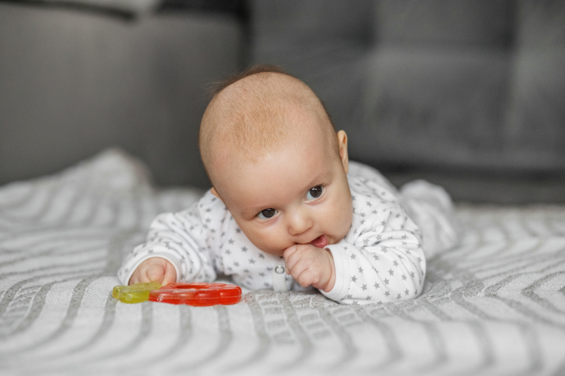 photo of baby on blanket showing head