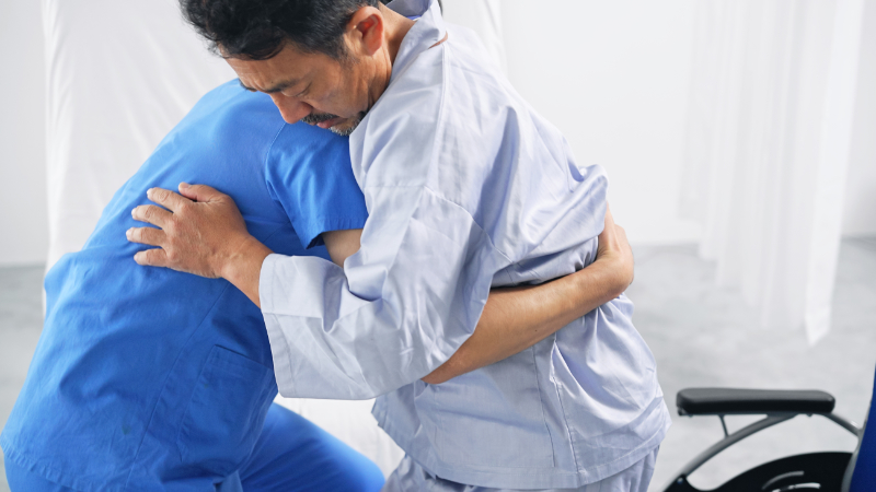 photo of patient being transferred from sitting to standing